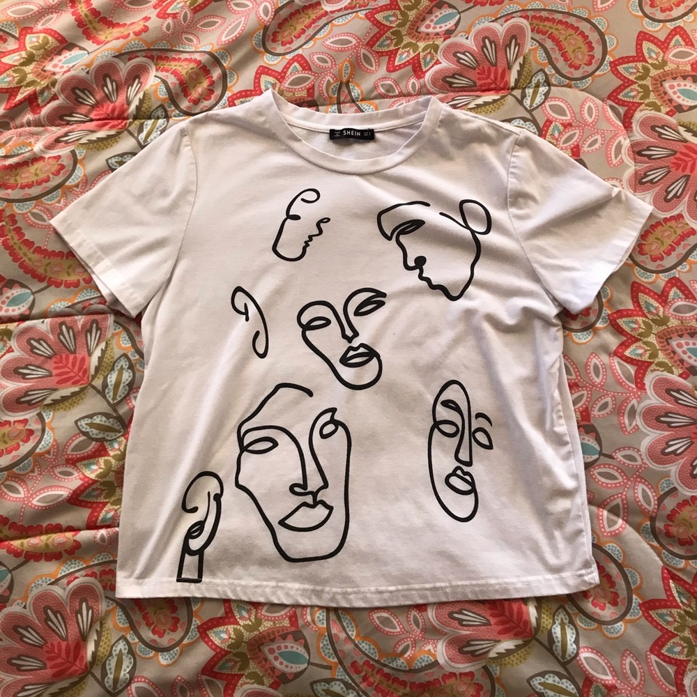 White top with faces